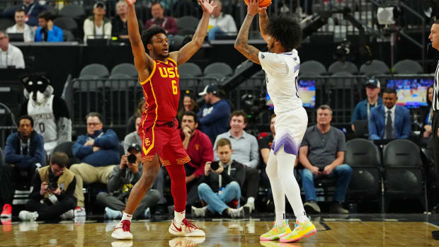 USC Trojans guard Bronny James defends Washington Huskies guard Koren Johnson.